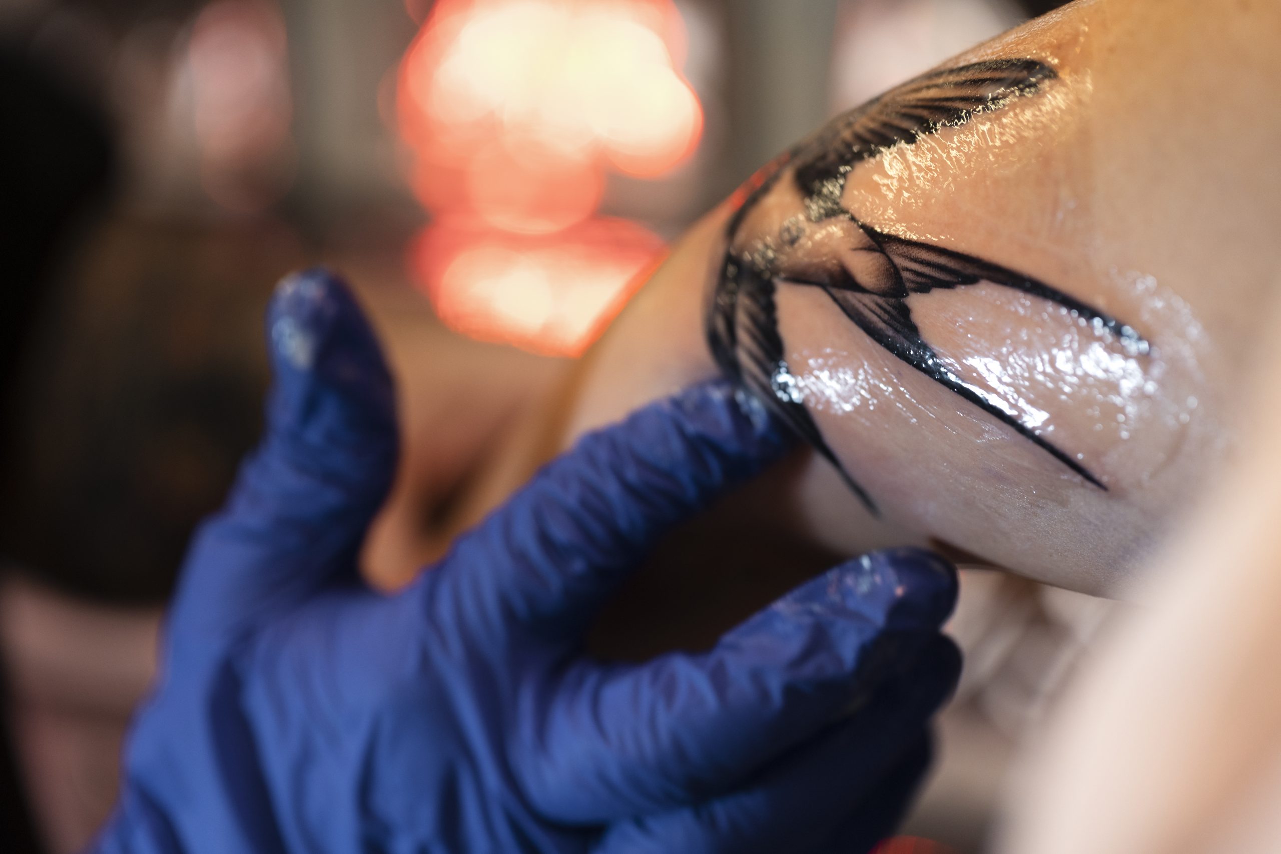 experienced-tattoo-artist-working-client-tattoo